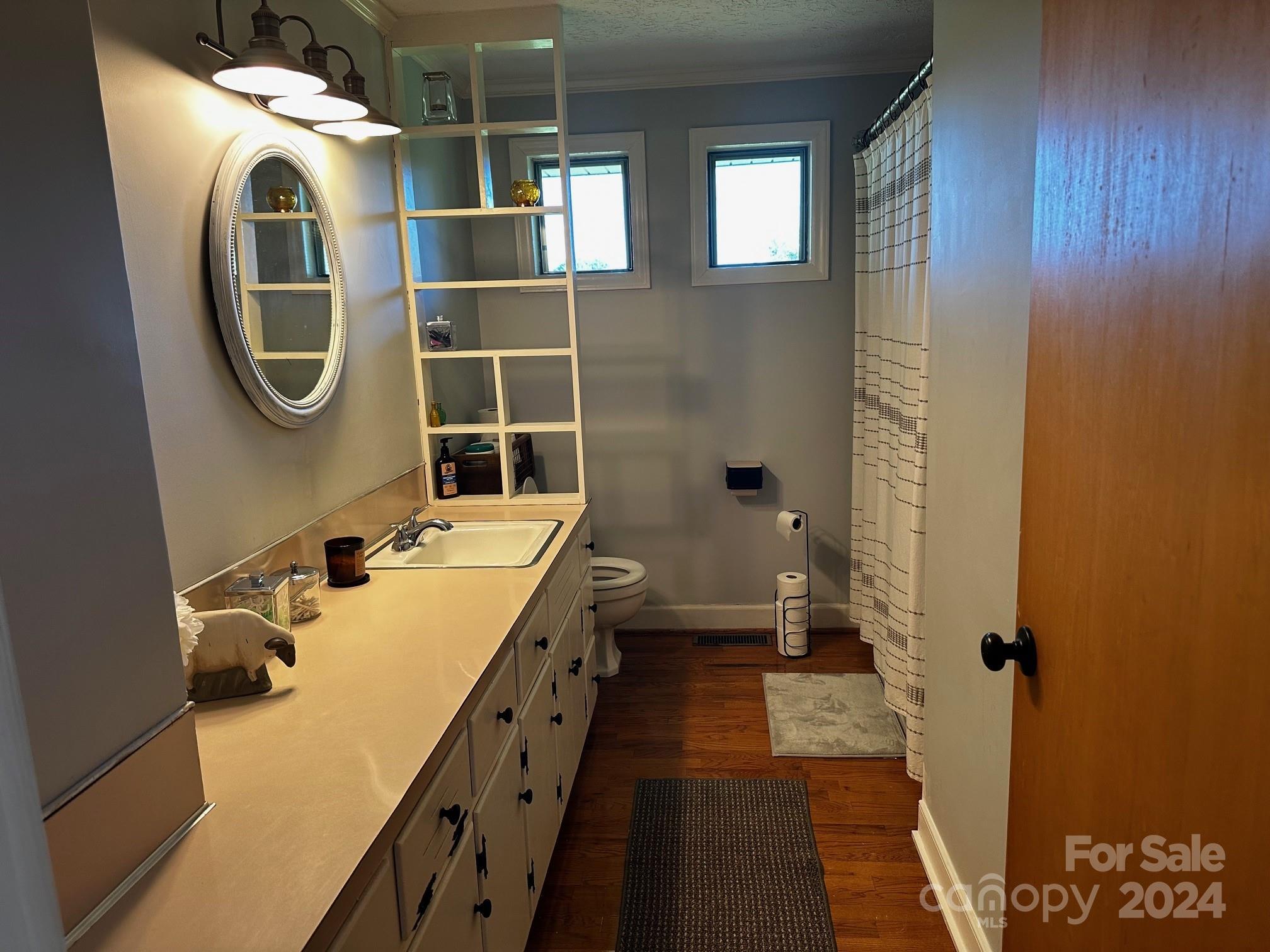 303 Legion Road Hudson, NC 28638 - Photo 15 of 32 a bathroom with a sink and a mirror