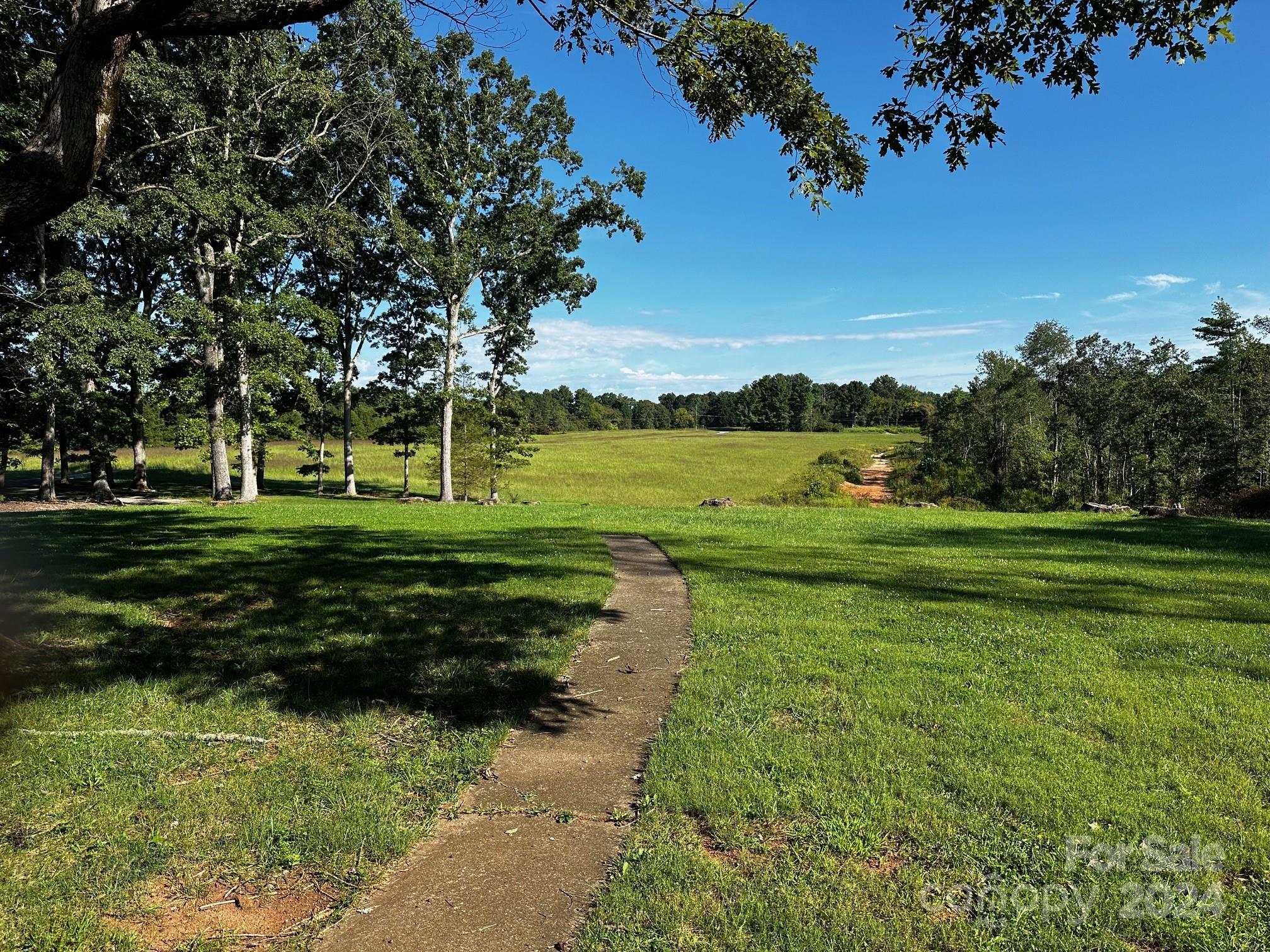 303 Legion Road Hudson, NC 28638 - Photo 23 of 32 a view of a golf course with a garden