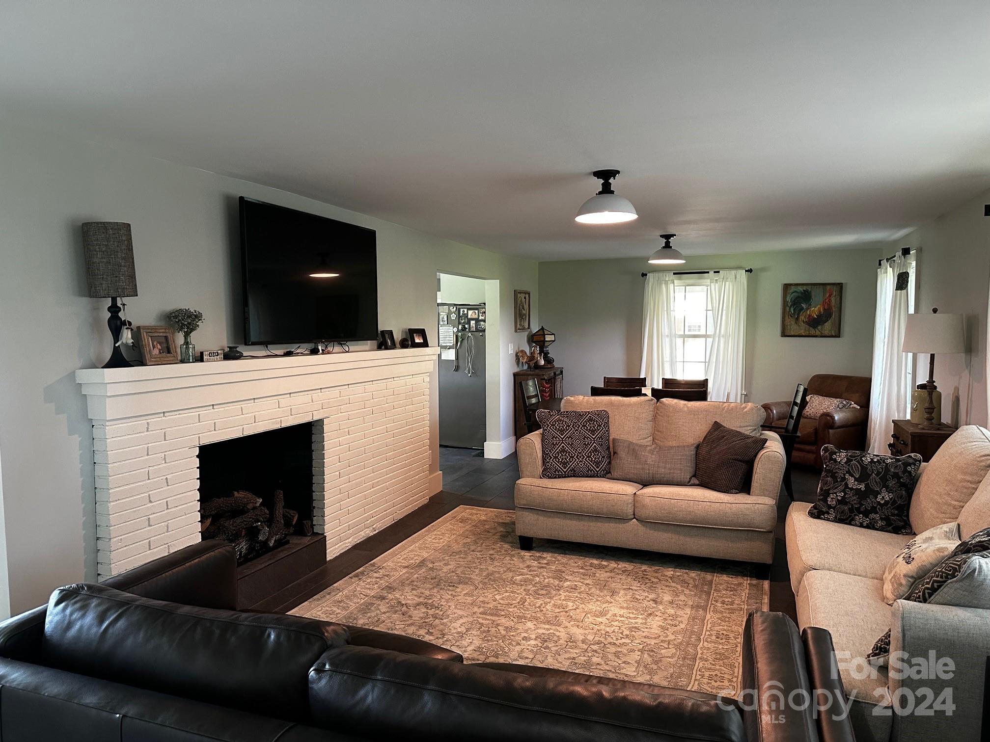 303 Legion Road Hudson, NC 28638 - Photo 29 of 32 a living room with furniture and a fireplace