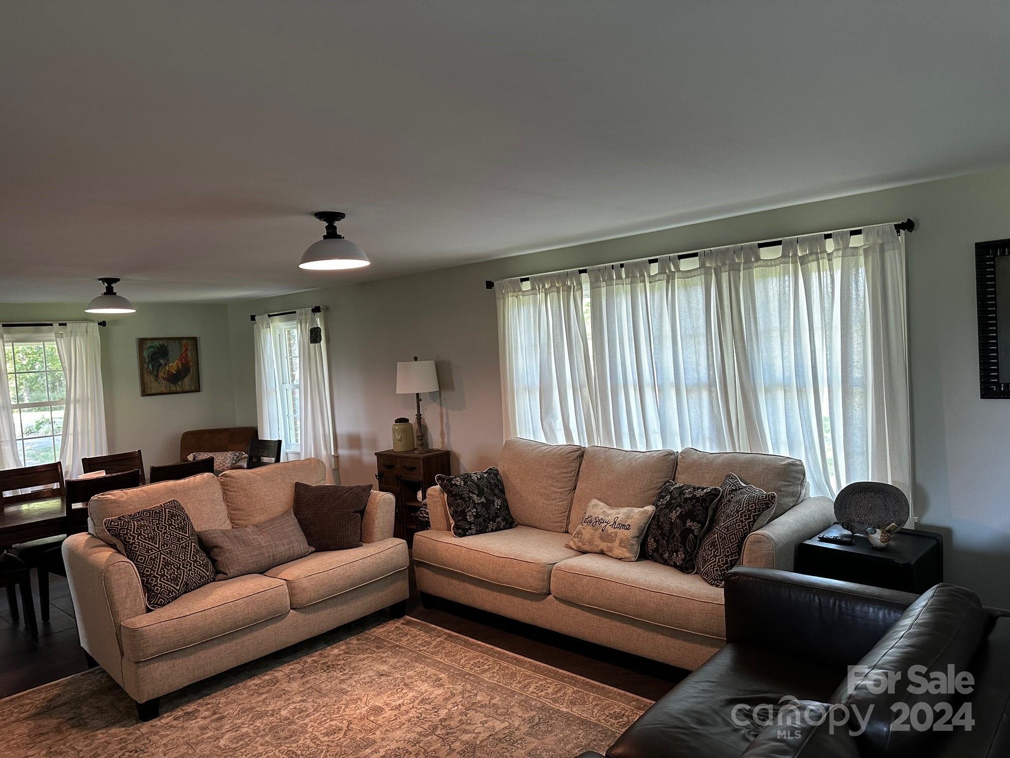 303 Legion Road Hudson, NC 28638 - Photo 30 of 32 a living room with furniture couch and a window