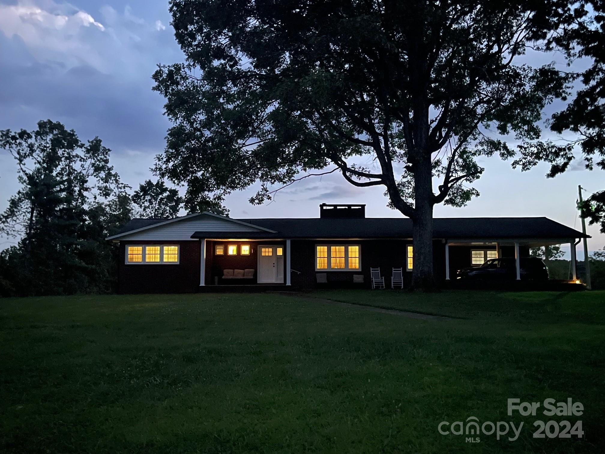 303 Legion Road Hudson, NC 28638 - Photo 3 of 32 a house view with a garden space