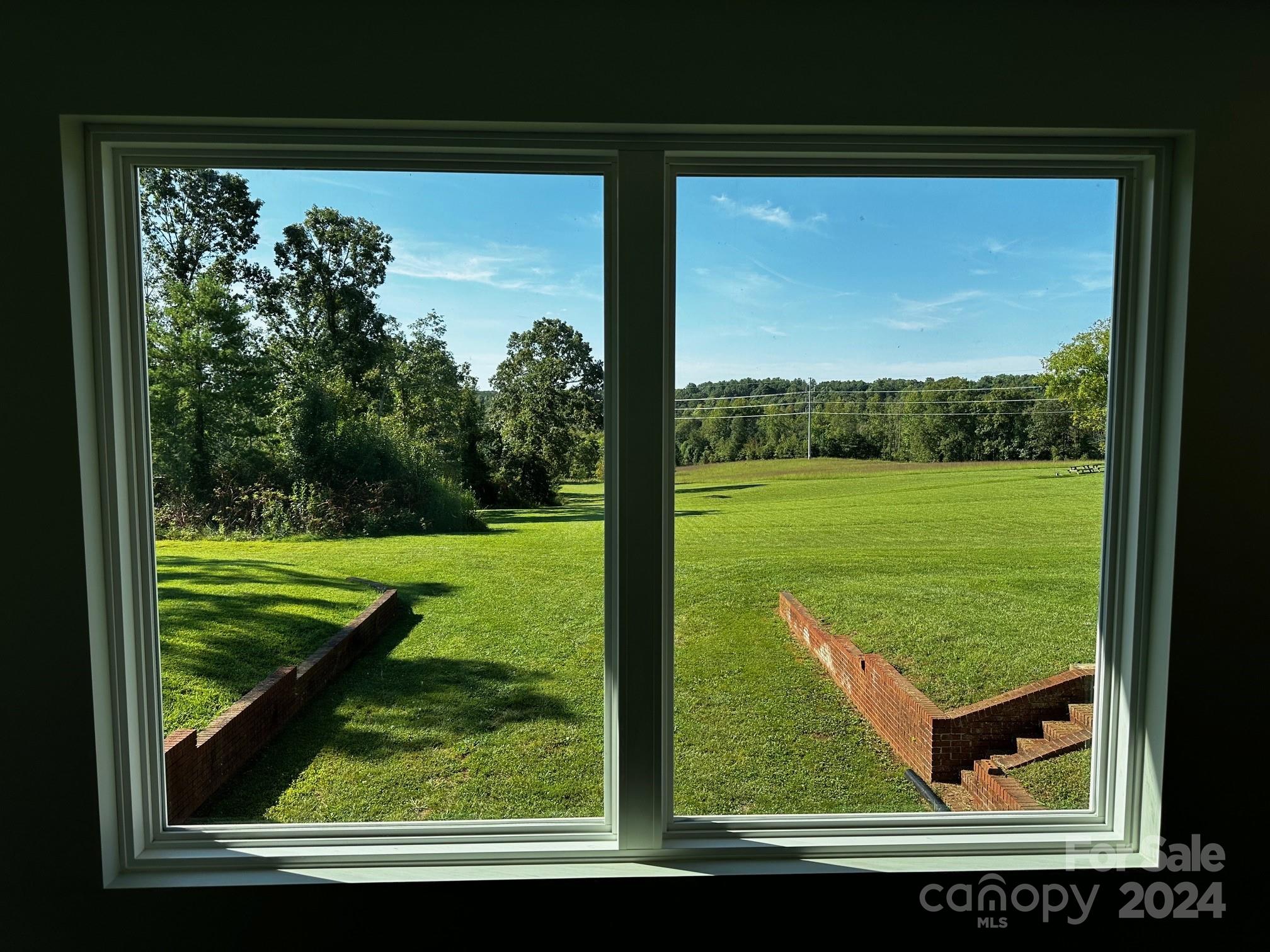 303 Legion Road Hudson, NC 28638 - Photo 4 of 32 a view of a back yard from a window
