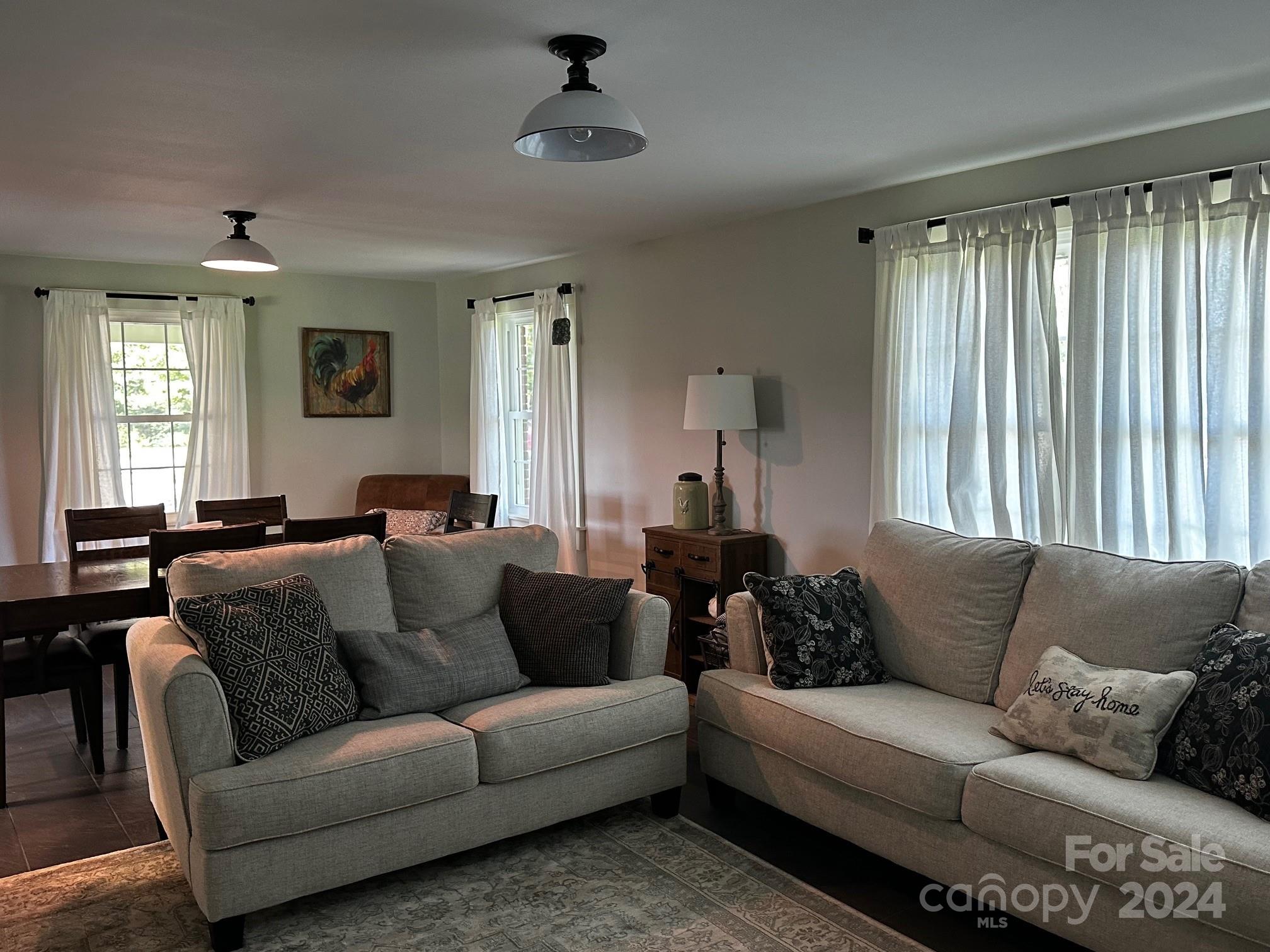 303 Legion Road Hudson, NC 28638 - Photo 9 of 32 a living room with furniture and a large window