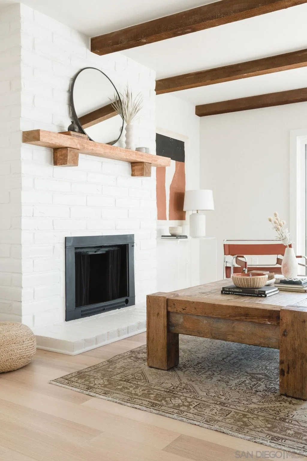 180 Spanish Spur Fallbrook, CA 92028 - Photo 10 of 44 a living room with a fireplace and a table