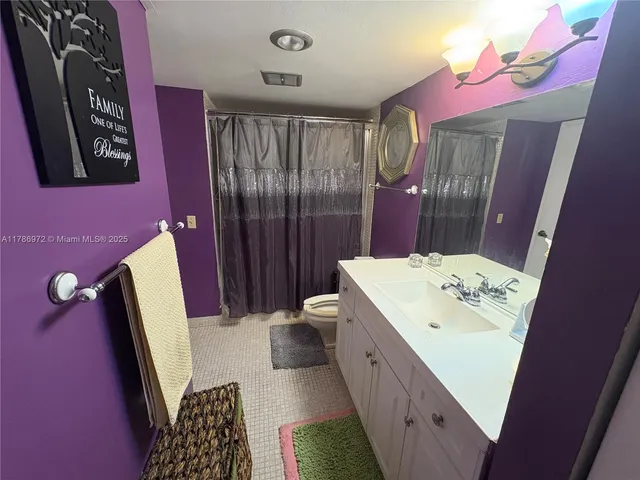 a bathroom with a sink a vanity and a mirror