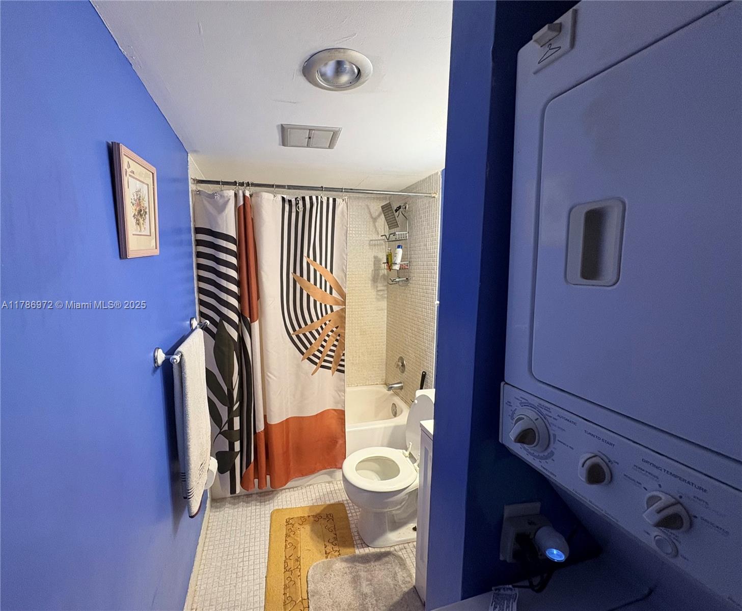 4152 Inverrary Drive, Unit 303 Lauderhill, FL 33319 - Photo 7 of 11 a bathroom with a toilet a sink and mirror