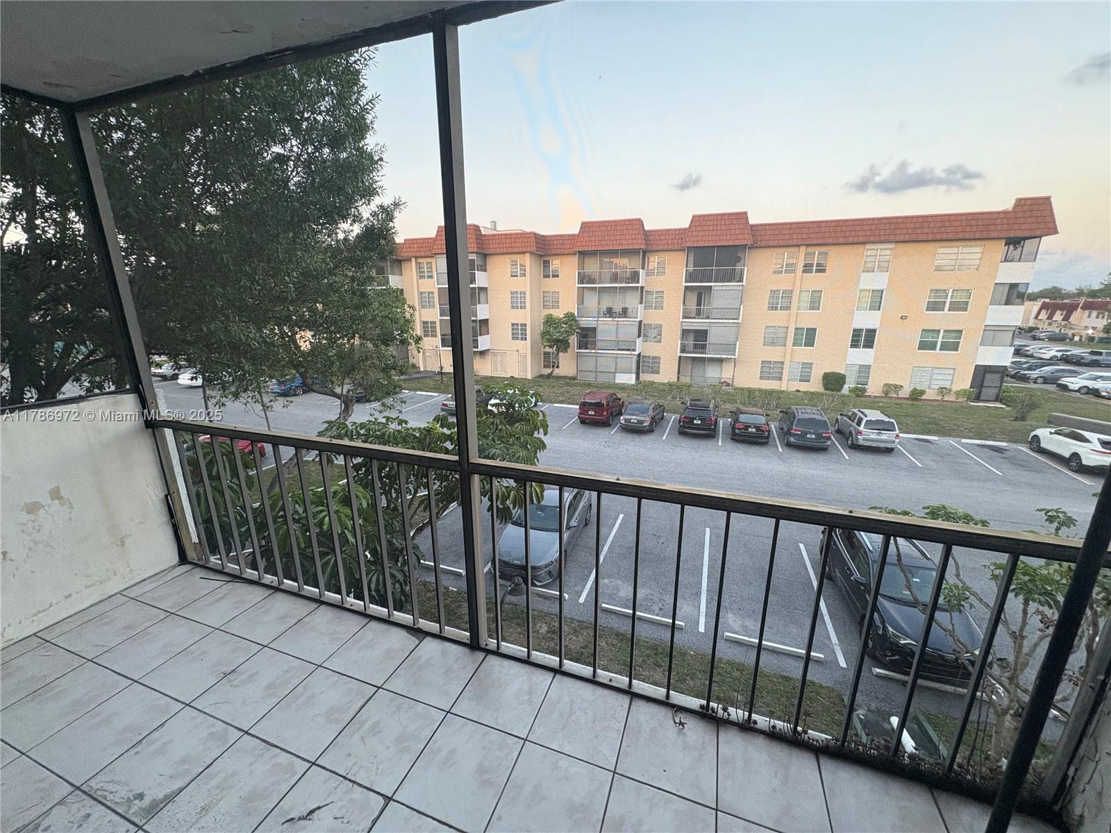 4152 Inverrary Drive, Unit 303 Lauderhill, FL 33319 - Photo 10 of 11 a balcony with street view