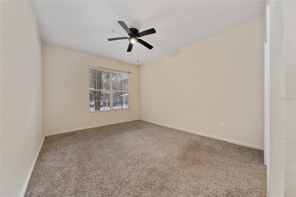 3001 Greystone Loop, Unit 103 Kissimmee, FL 34741 - Photo 14 of 31 a view of an empty room with a window