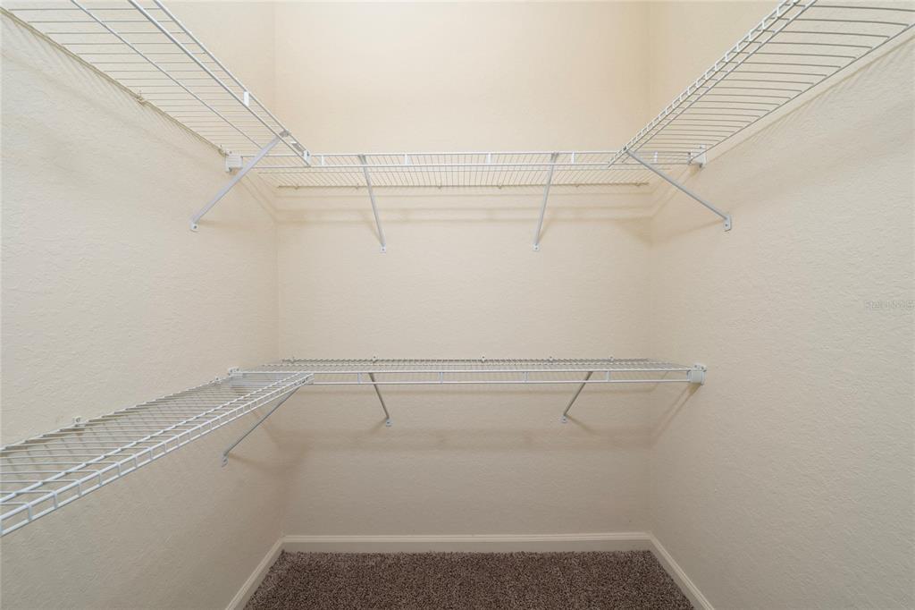 3001 Greystone Loop, Unit 103 Kissimmee, FL 34741 - Photo 18 of 31 a view of a room with racks on the wall