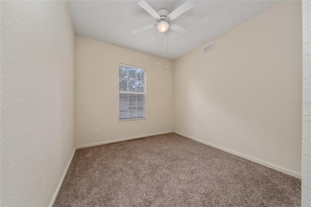 3001 Greystone Loop, Unit 103 Kissimmee, FL 34741 - Photo 23 of 31 an empty room with a window