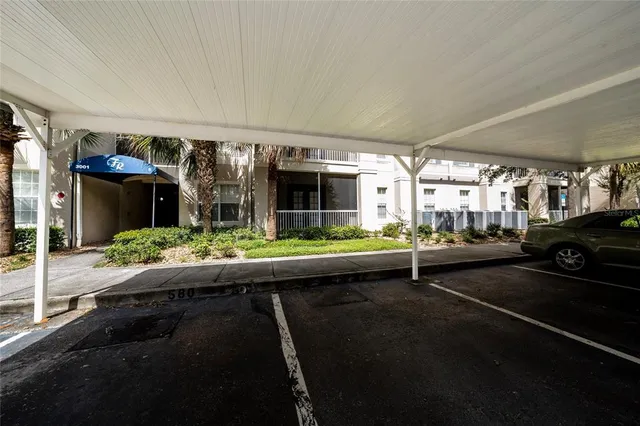 a room with pool table and windows