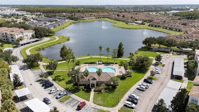 an aerial view of a house with a swimming pool yard and outdoor seating
