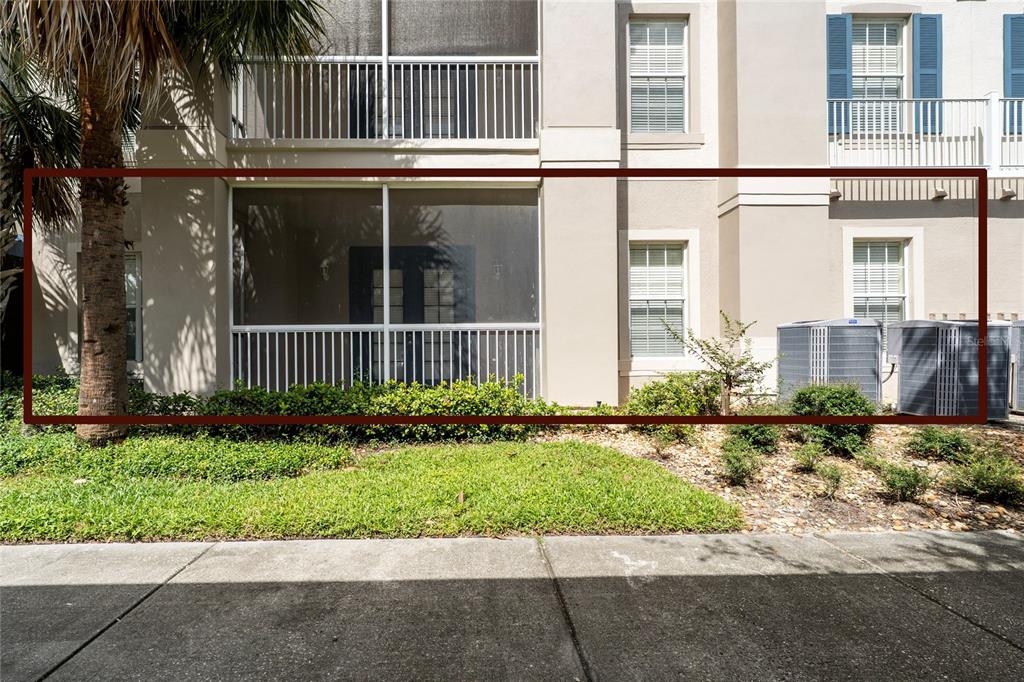 3001 Greystone Loop, Unit 103 Kissimmee, FL 34741 - Photo 3 of 31 front view of a house with a yard