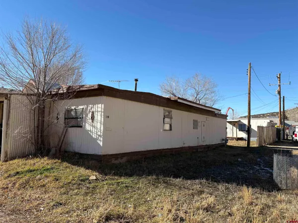 a view of a street with a building in the background