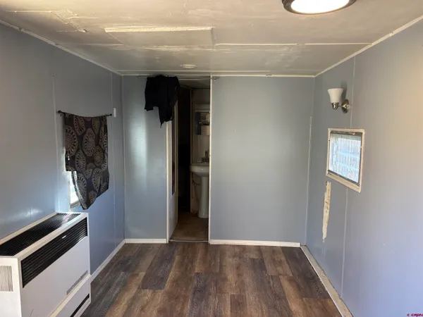 a view of hallway with wooden floor