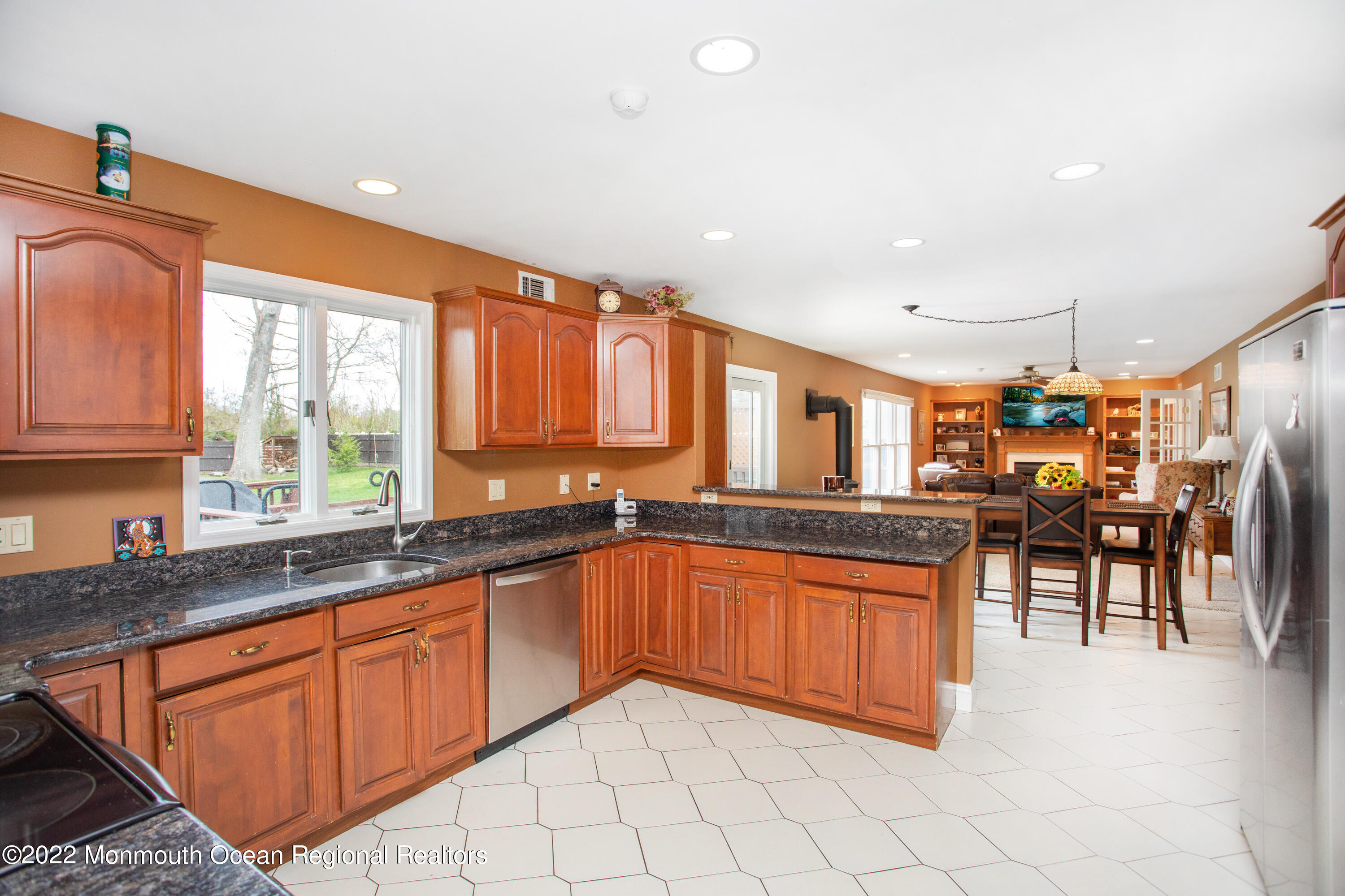 2606 Woolley Road Wall, NJ 07719 - Photo 13 of 47 a kitchen with stainless steel appliances granite countertop a sink and cabinets