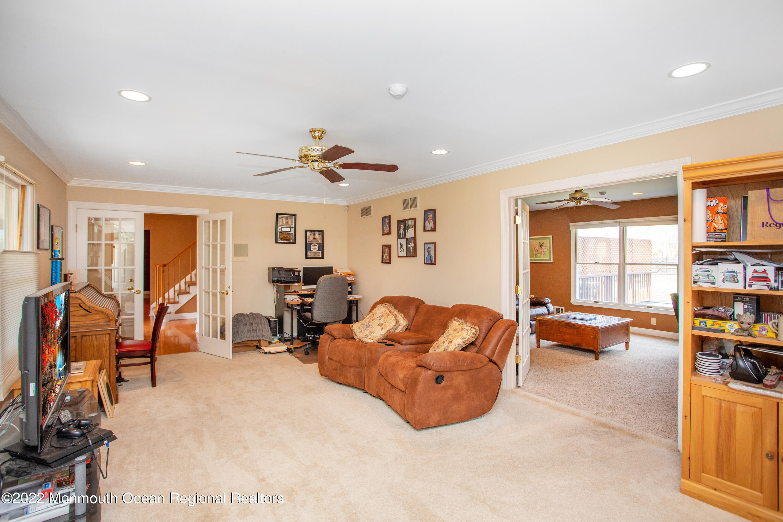 2606 Woolley Road Wall, NJ 07719 - Photo 8 of 47 a living room with furniture and a book shelf