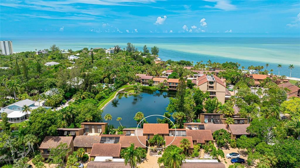 an aerial view of a house with a lake view