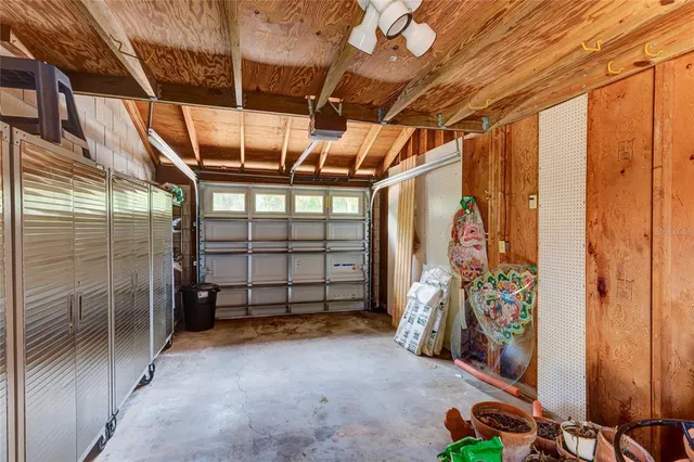 a view of a chair and table in backyard