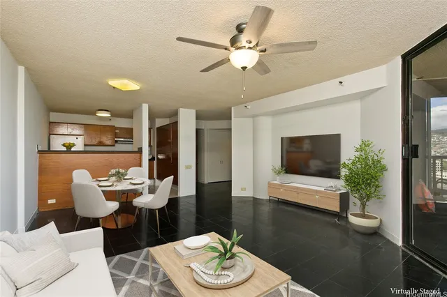 a living room with furniture and a flat screen tv