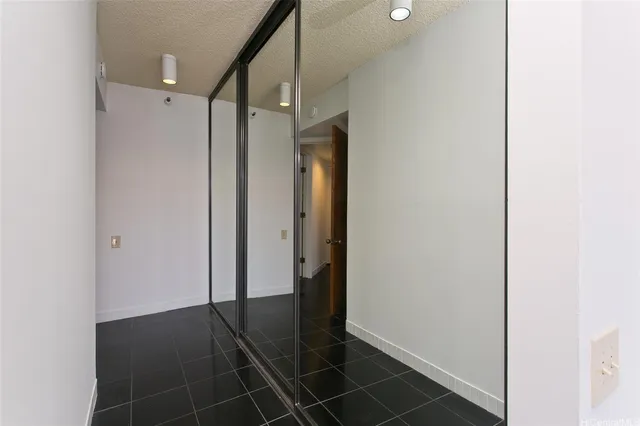 a bathroom with a shower and a mirror