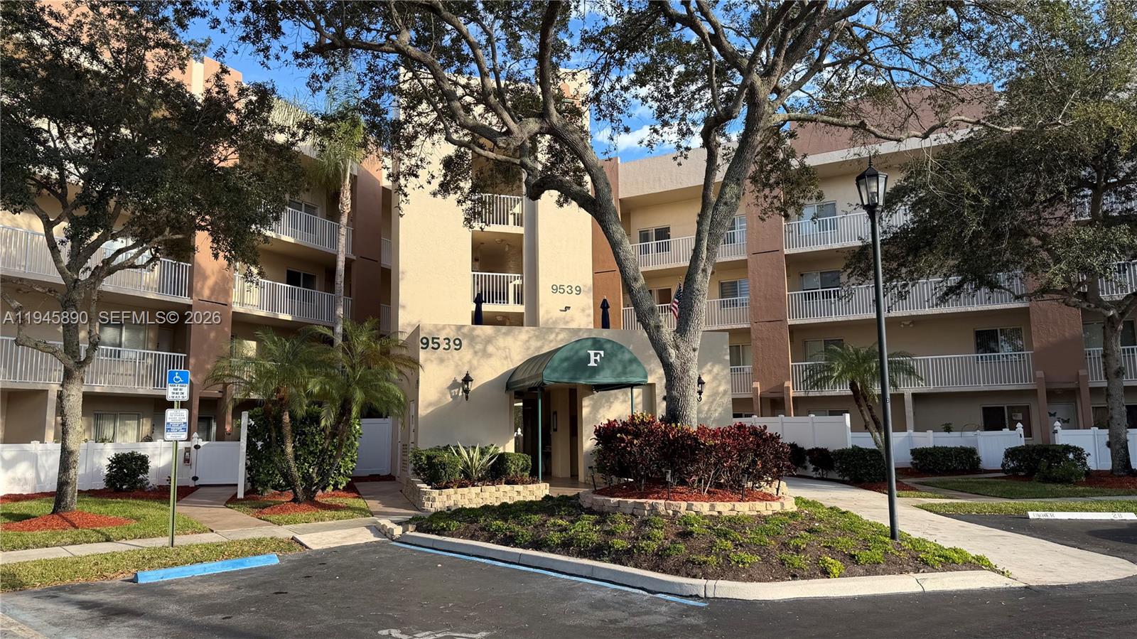 9539 Weldon Circle, Unit F207 Tamarac, FL 33321 - Photo 22 of 22 a front view of a building with street view
