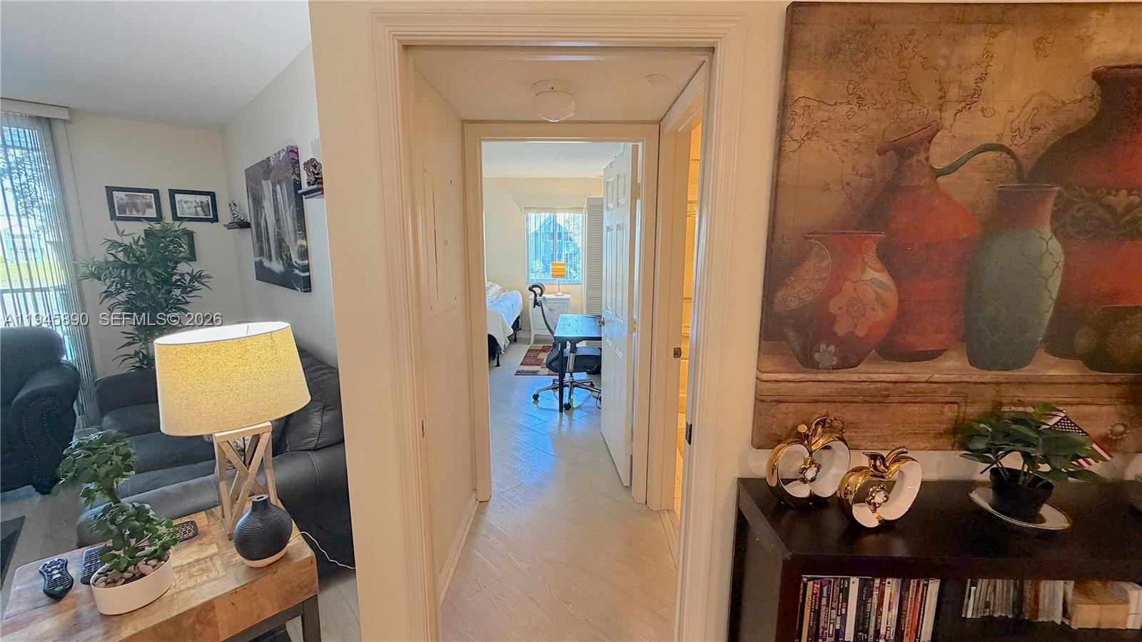 9539 Weldon Circle, Unit F207 Tamarac, FL 33321 - Photo 9 of 22 a view of a livingroom with furniture and wooden floor