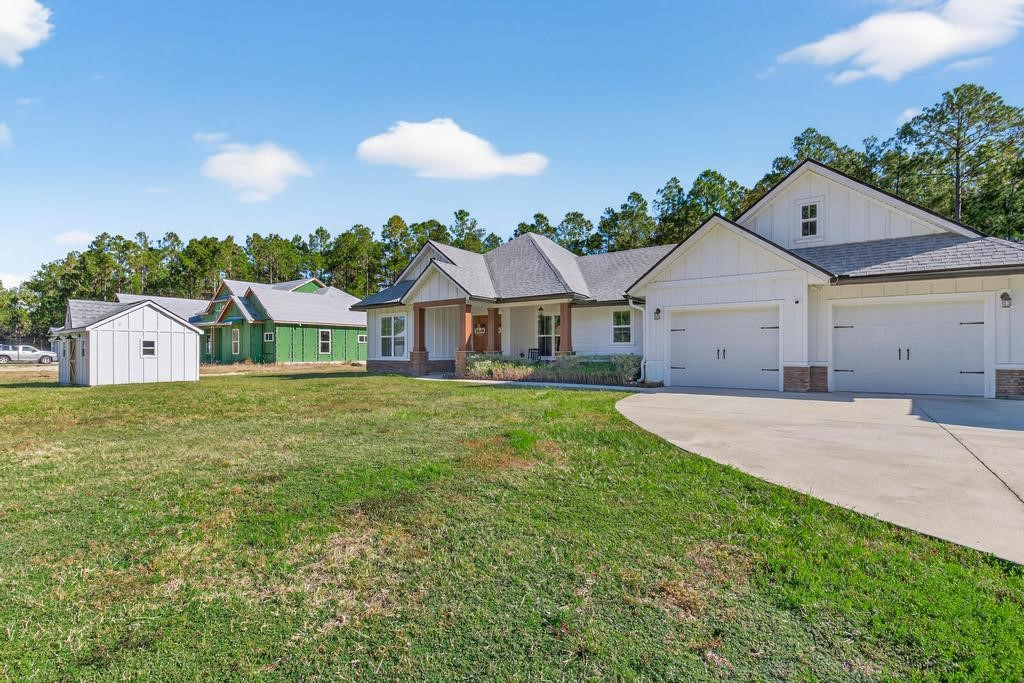 75774 Edwards Road Yulee, FL 32097 - Photo 7 of 70 a house view with a garden space