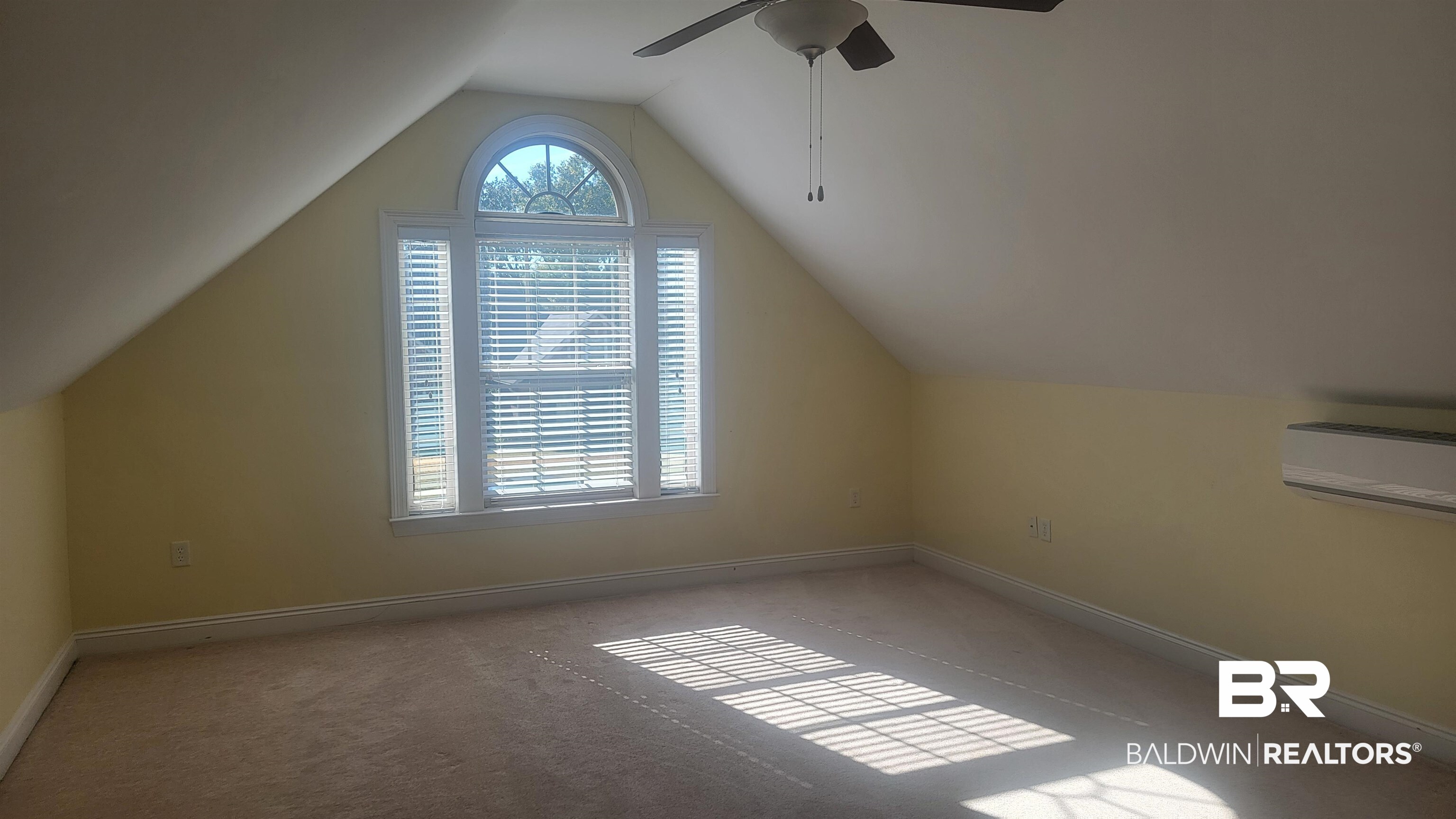 306 South Tee Drive Fairhope, AL 36532 - Photo 23 of 37 Bonus room featuring light carpet, a wall unit AC, ceiling fan, and lofted ceiling