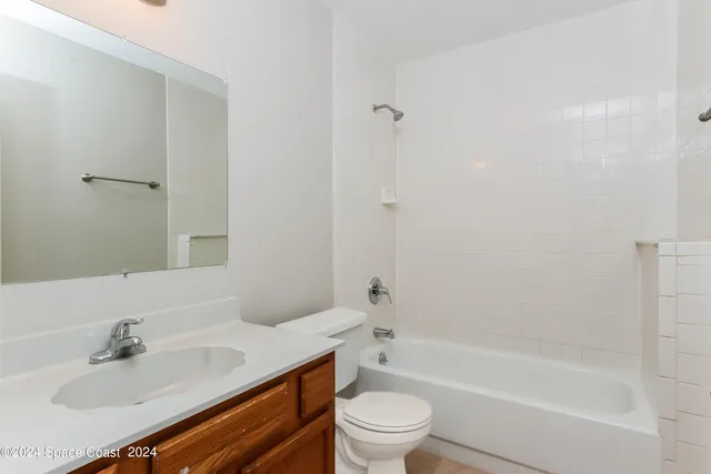 a bathroom with a sink a toilet and a bathtub