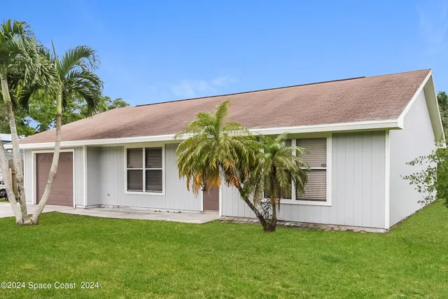 a house with a yard in front of it