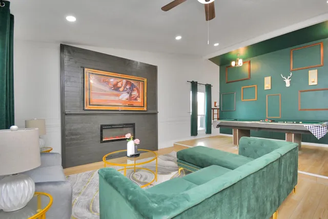 a living room with furniture and a flat screen tv