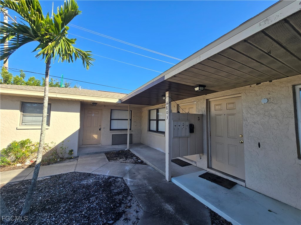 4803 Triton Court East, Unit 2 Cape Coral, FL 33904 - Photo 18 of 18 a view of a house with a patio