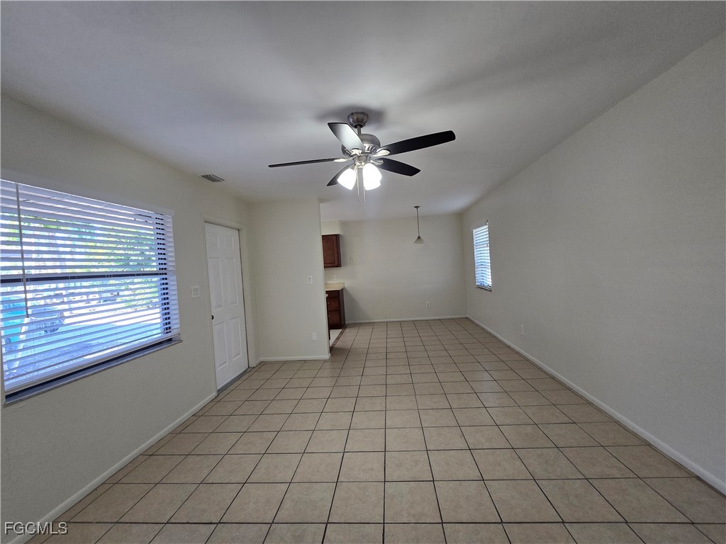 4803 Triton Court East, Unit 2 Cape Coral, FL 33904 - Photo 5 of 18 a view of an empty room with a window