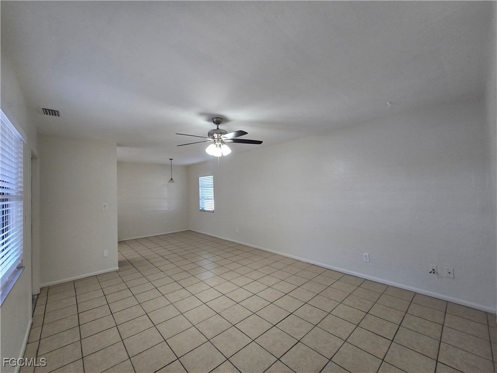 4803 Triton Court East, Unit 2 Cape Coral, FL 33904 - Photo 7 of 18 wooden floor in an empty room