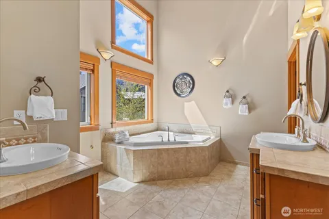 a en suite bathroom with sink and mirror