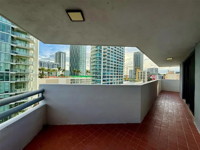 a view of backyard with sitting area