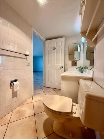 a view of a hallway with washer and dryer