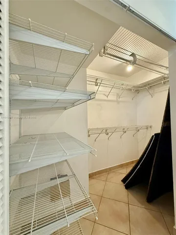 a bathroom with a toilet sink and shower