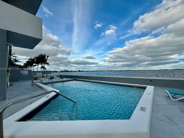 a room with gym equipment and floor to ceiling window