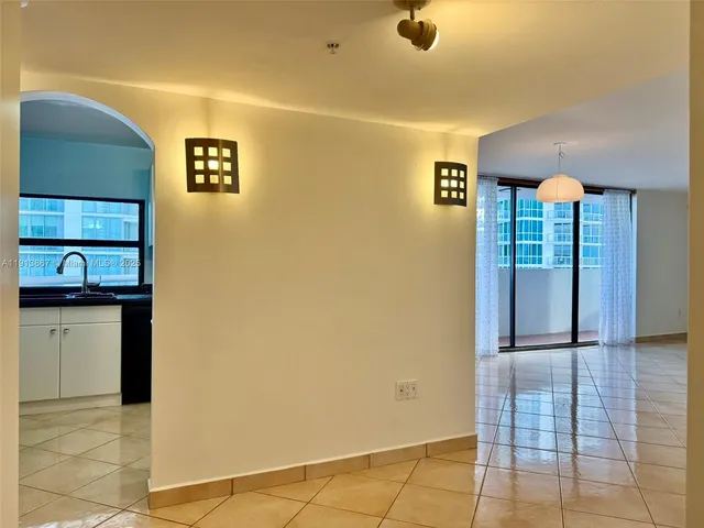 a view of an entryway with a kitchen