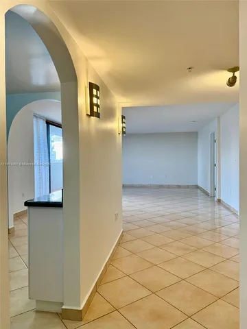 a view of a livingroom with wooden floor and cabinet