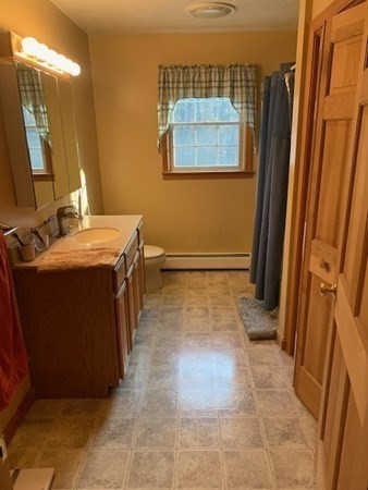 87 Oxford Road Charlton, MA 01507 - Photo 15 of 22 a room with a sink and a mirror