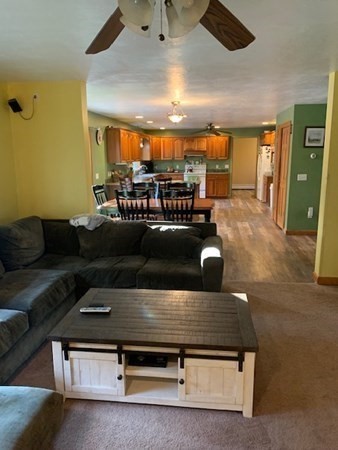 87 Oxford Road Charlton, MA 01507 - Photo 5 of 22 a living room with furniture and a chandelier