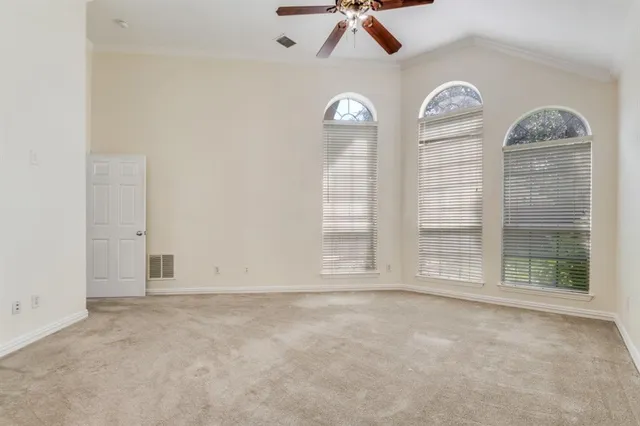a view of a room with a large window