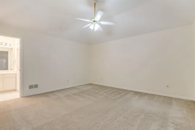 a spacious bathroom with a double vanity sink mirror and