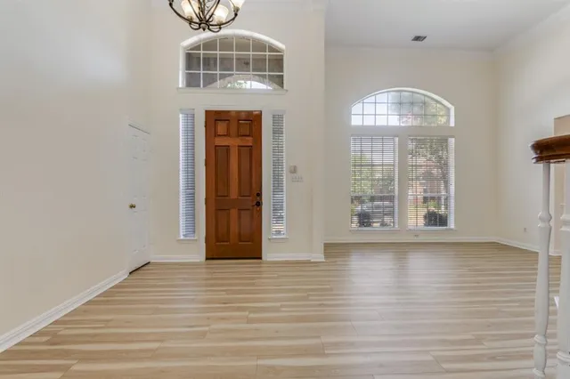 a view of livingroom with hardwood floor and hallway