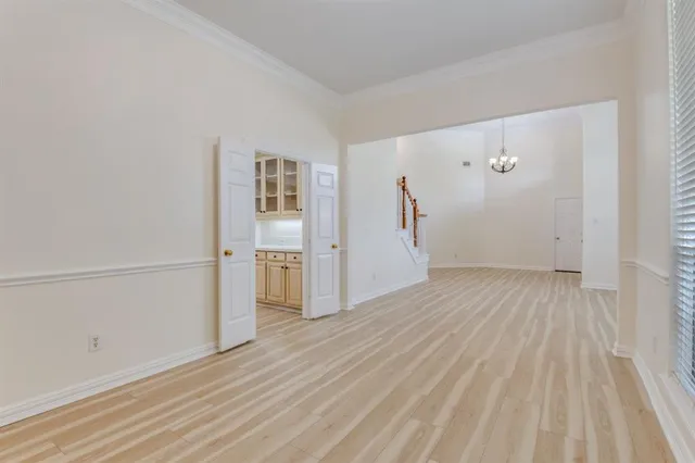 a kitchen with granite countertop cabinets stainless steel appliances and a wooden floor