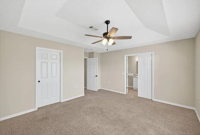 a view of a yard with table and chairs and a fire pit