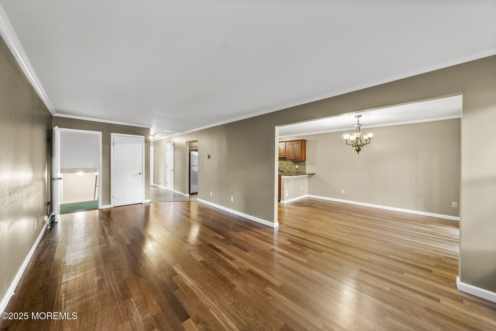63 Atrium Way, Unit 63 Manalapan, NJ 07726 - Photo 13 of 40 a view of a hallway with wooden floor